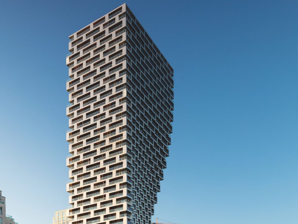 A rendering of Vancouver House, a dramatic skyscraper with floors becoming larger as it rises.
