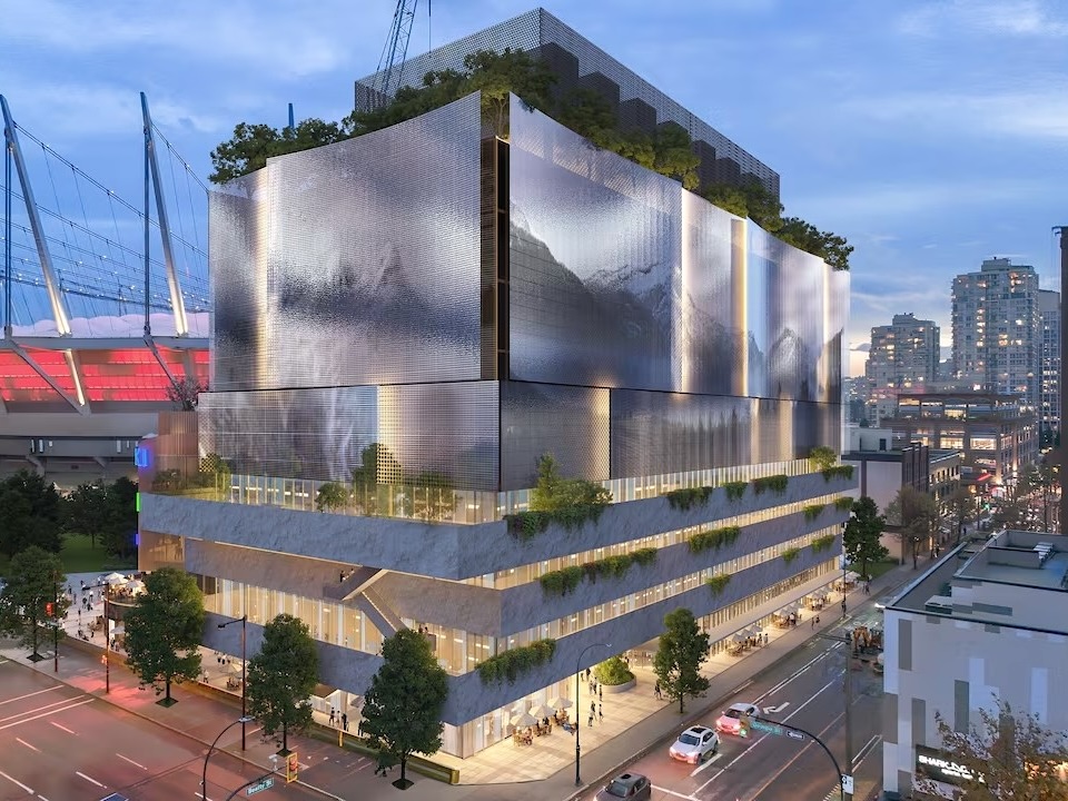 A rendering of a futuristic-looking building on a busy downtown street.