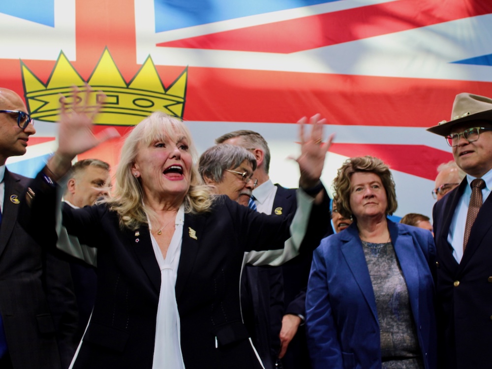 Kerry-Lynn Findlay raises her arms in triumph after being elected the leader of the BC Conservatives.