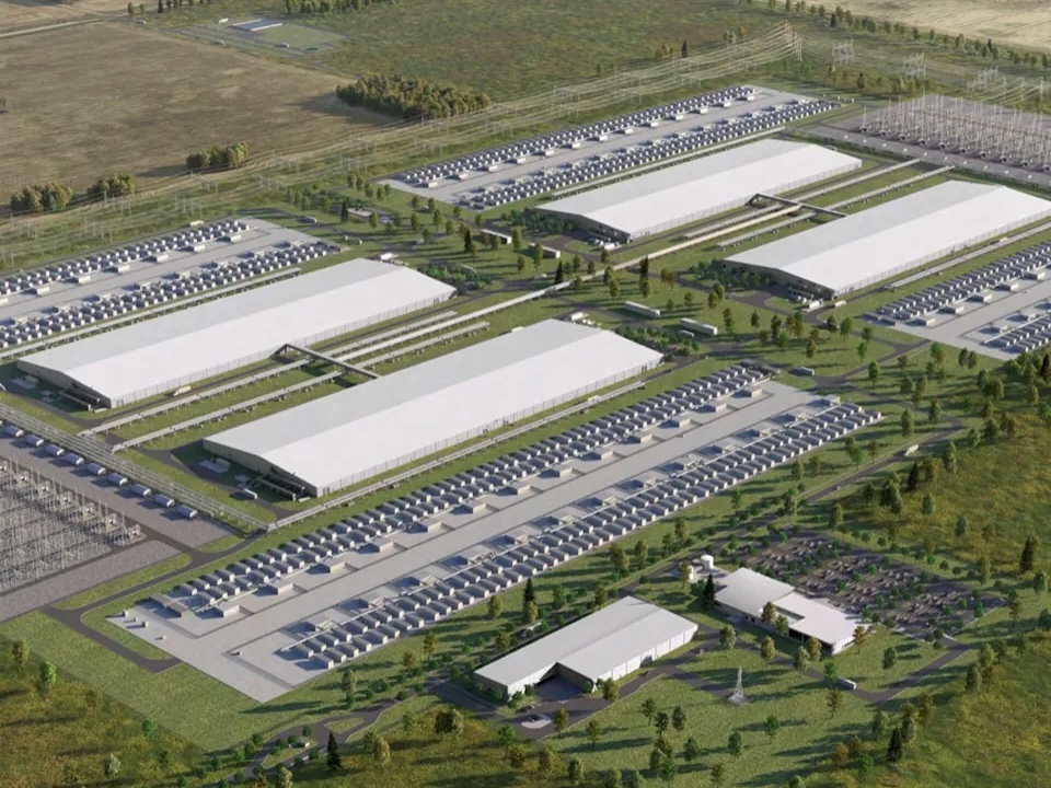 An illustration shows a sprawling complex of large buildings in a prairie landscape.