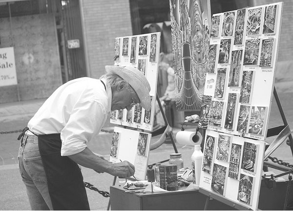 Man painting paintings