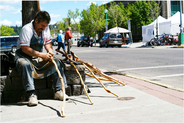 Man carving sticks