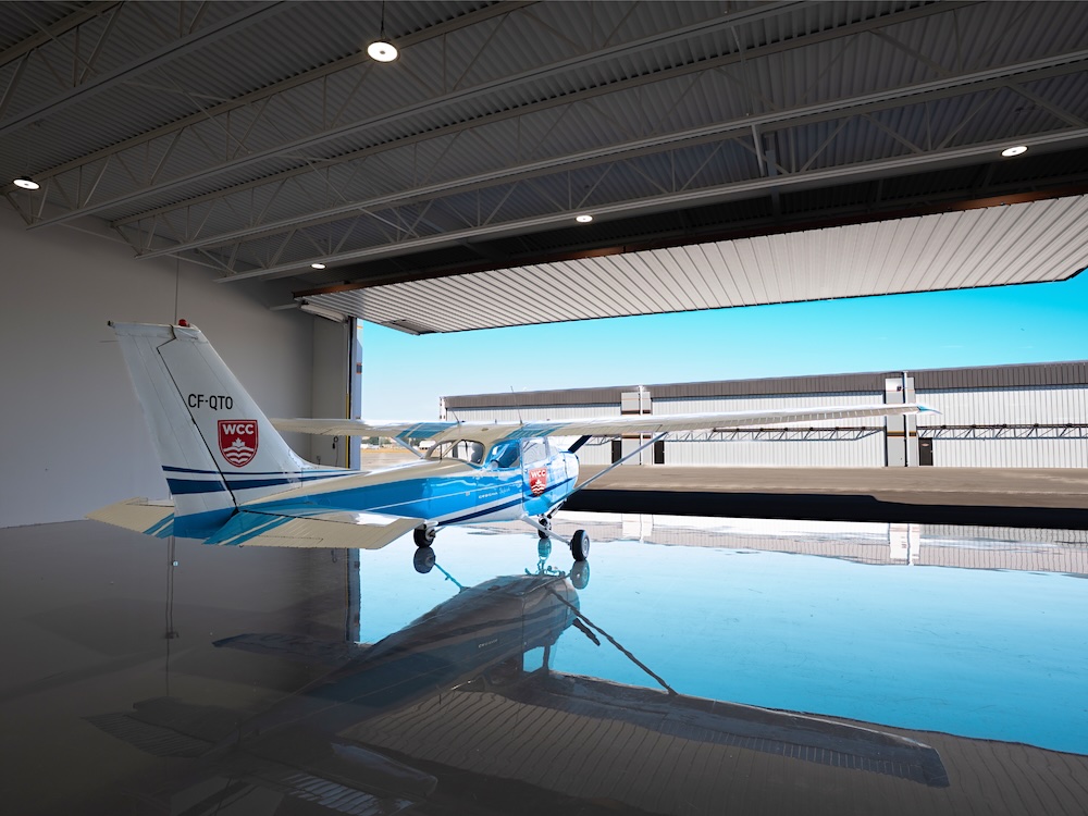 A Western Community College plane in a hangar. 