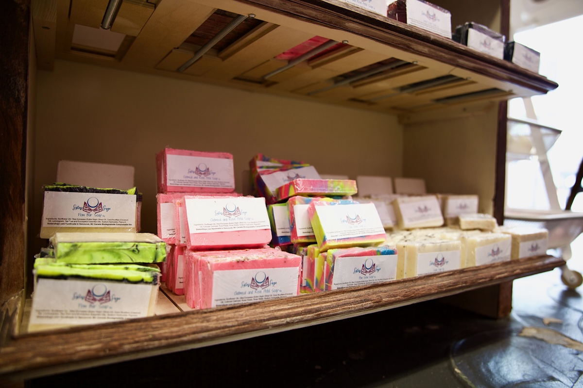 Packaged soap bars on shelves.