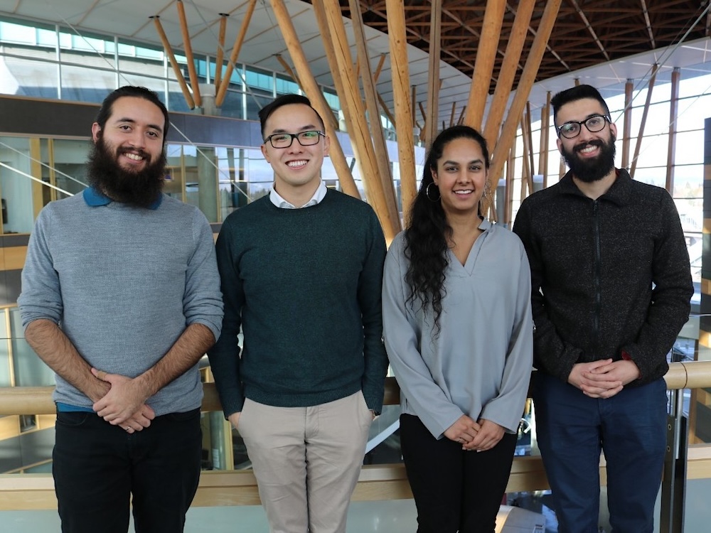 From left to right, Gabriel Soares, Edward Chiang, Sumreen Rattan and Gurmesh Sidhu stand in an airy office-like space.